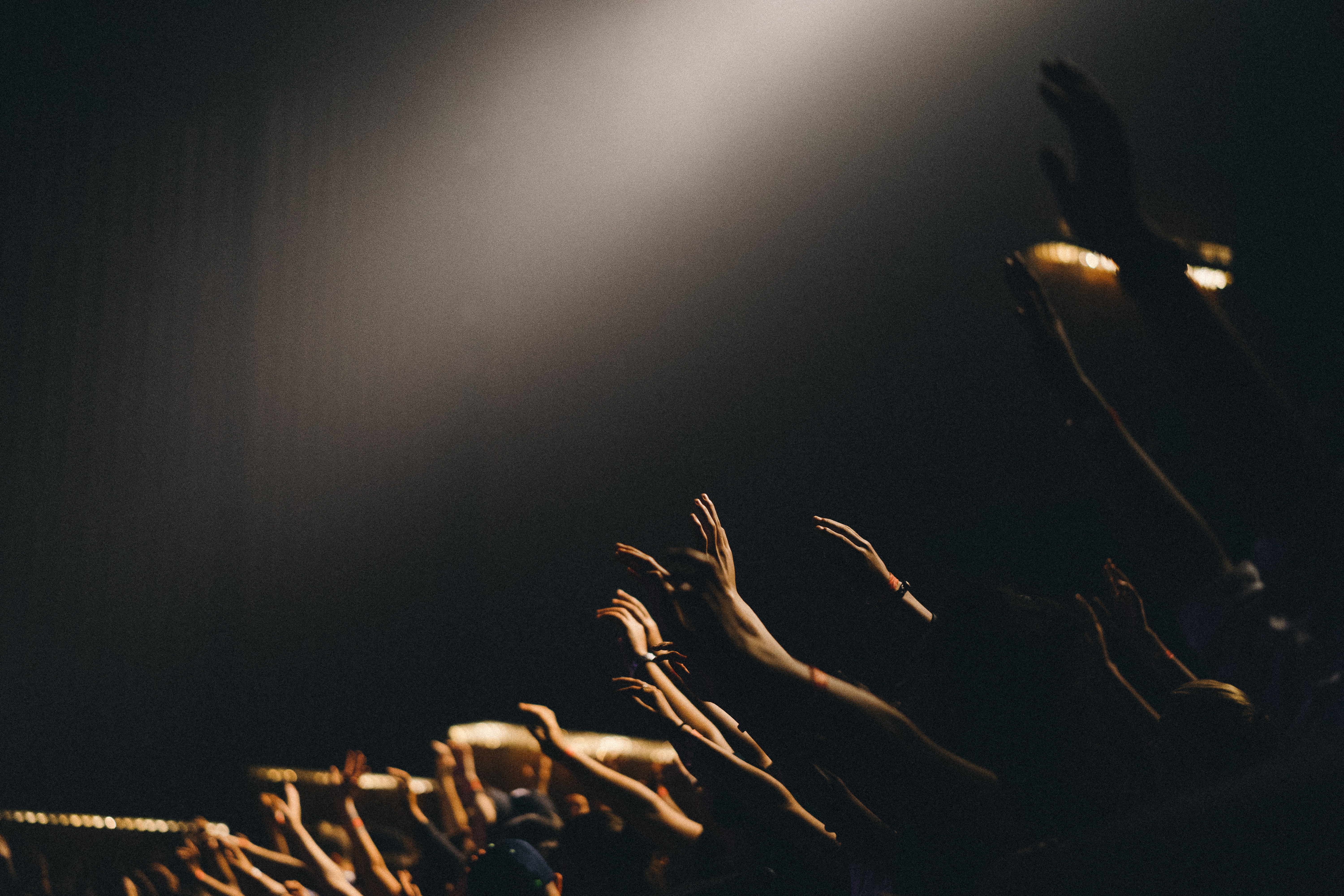 Worshippers with hands raised at the Revival concert